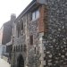 This building was built as a merchant's fortified house in c1150. It was later used as the medieval Town Hall, Court of Justice and prison. It was also the place for the receipt of port dues (taxes). By 1552 it was owned by the towns Corporation. It continued in use until 1882-3 when the new Town Hall was built. After this date the prison buildings west of the Tolhouse were demolished and the building was restored. It was used as a museum and library from the 1880s. It was damaged by bombing in 1941 and restored in 1961.