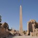 There are two obelisks still standing at Karnak. The obelisk erected by Queen Hatshepsut (1473-1458BC). is 97 feet tall and weighs approximately 320 tons. An inscription at its base indicates that the work of cutting the monolith out of the quarry required seven months of labor. Nearby stands a smaller obelisk erected by Tuthmosis I (1504-1492 BC). It is 75 feet high, has sides 6 feet wide at its base, and weighs between 143 and 160 tons.