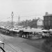This photograph of the Market Place was taken in September 1904. It shows the stalls all set up. You can also see the rails for the trams on the ground and the electric cables to power them up above. A line of horse and carts were the delivery vans of their day.

Geocaching Co-ordinates: N52°36.506 W001°43.597