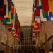 In this hall of nations hangs the flags of every country that the U.S. has diplomatic relations with.